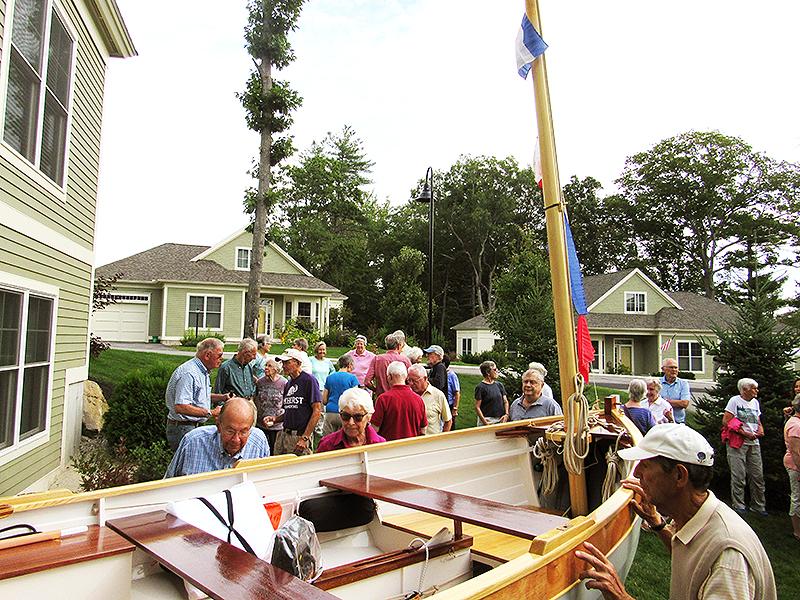 OceanView neighbors gathered for Tom's boat christening celebration.