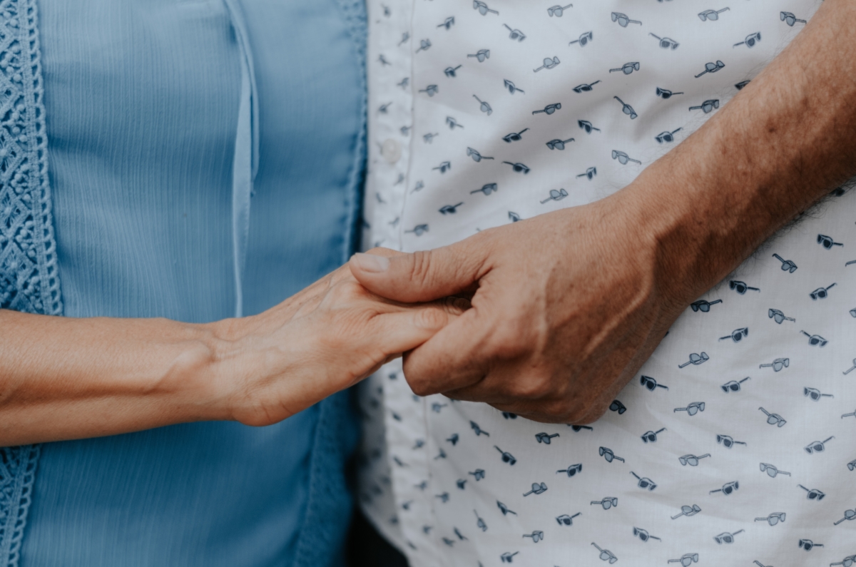 Mature Couple Holding Hands | Memory Care