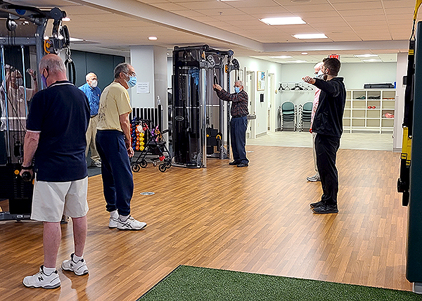 Men's exercise class in OceanView's Fitness Pavilion.