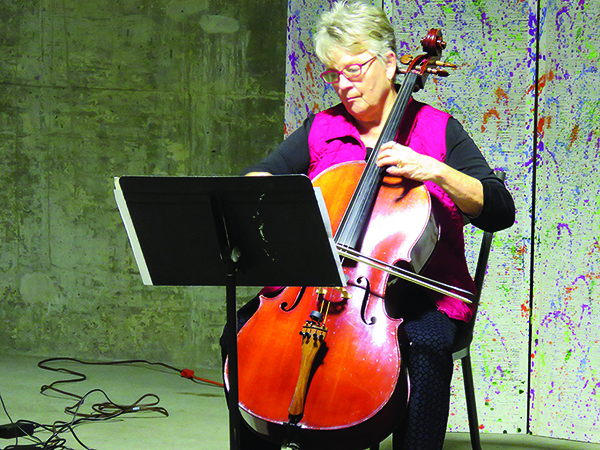 Resident Sally playing cello.