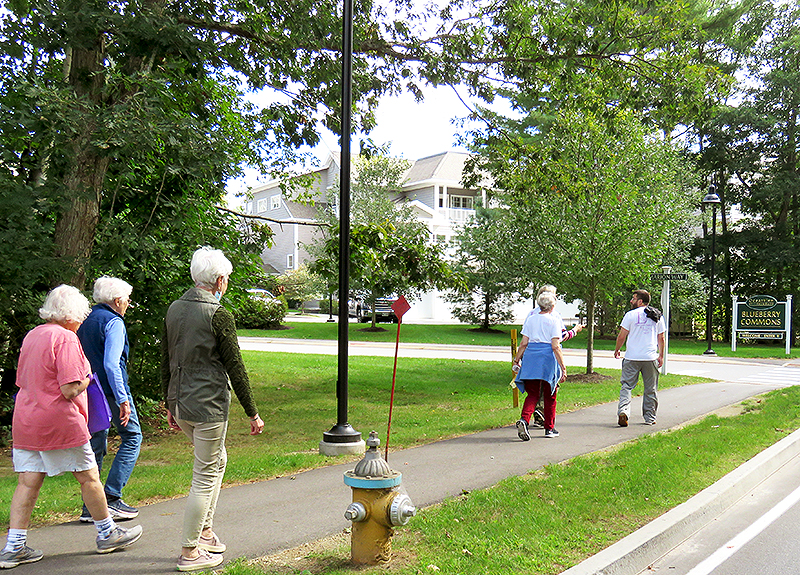 OceanView residents and staff walking on campus.