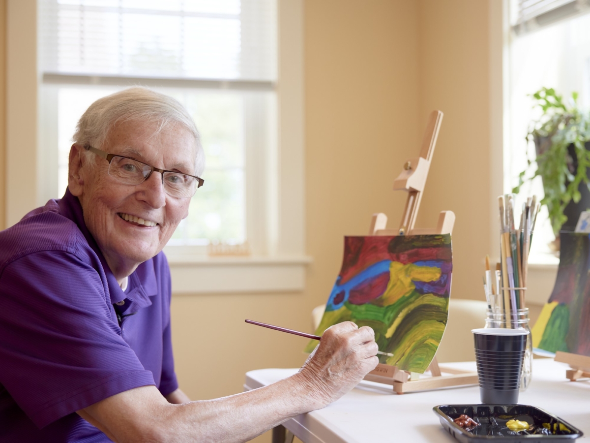 when to move to a retirement community | Image - Resident Painting at Falmouth House 4x3